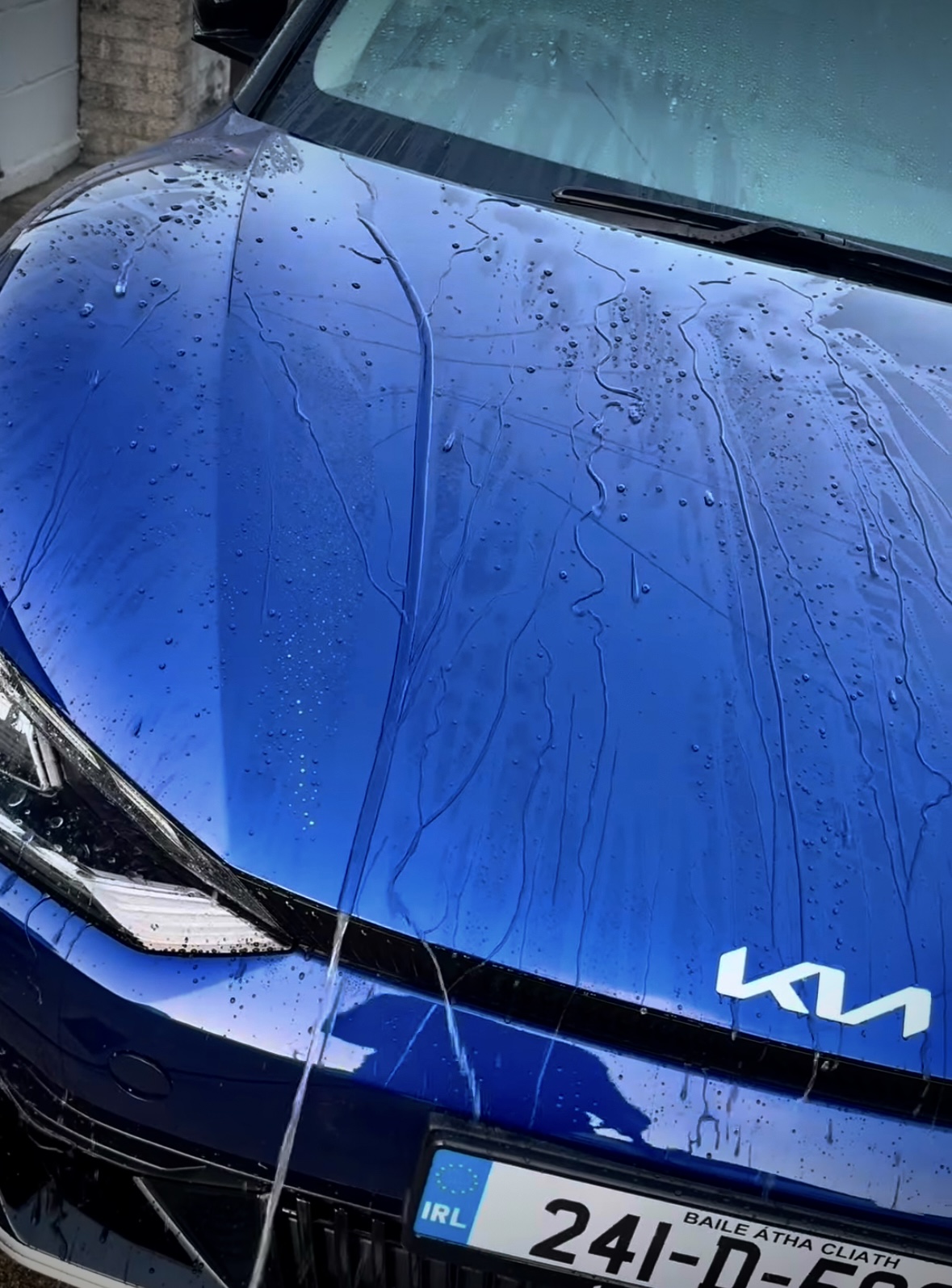 Car surface after ceramic coating showing hydrophobic protection